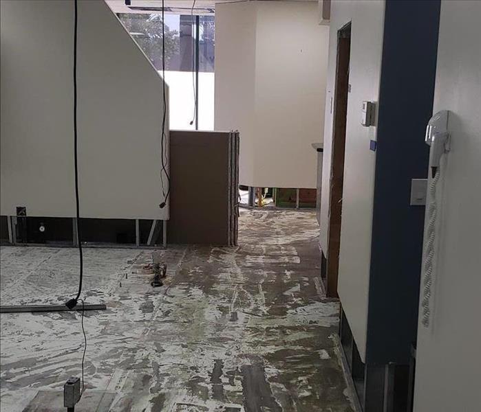 Photo of dental office with drywall cuts due to flooding.