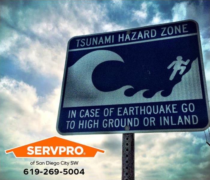 A tsunami zone sign is shown. 